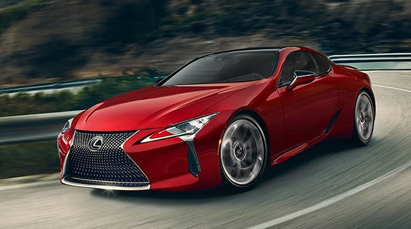 red Lexus lc-500 driving down a road in El Monte, California