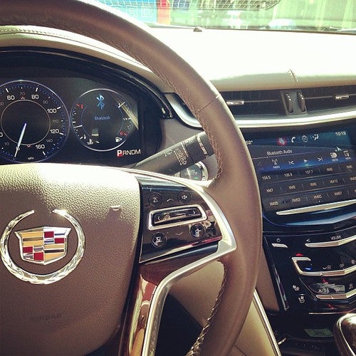 A brown Cadillac wheel with the logo