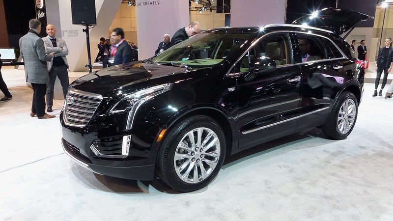 Black Cadillac SUV at auto show