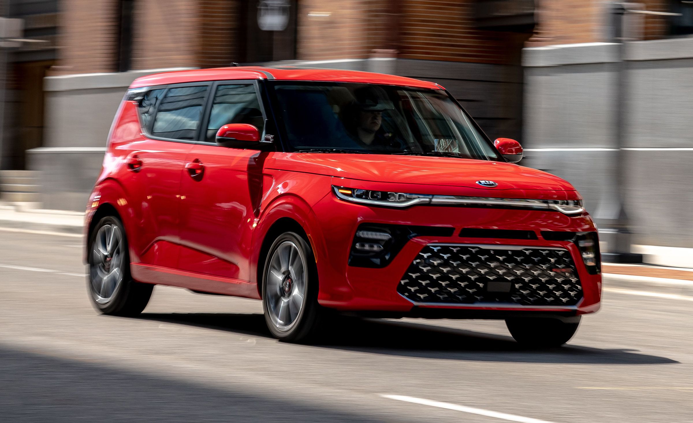 The 2022 Kia Soul drives down the road in Stuart, FL after being purchased from Wallace Kia.