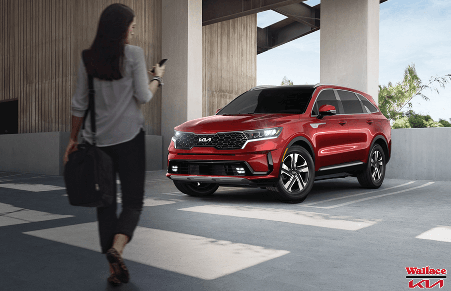 A woman starts her 2022 Kia Sorento SX near Stuart, FL after leaving a day of shopping.