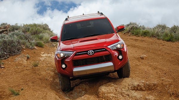 Red Toyota 4Runner off-roading