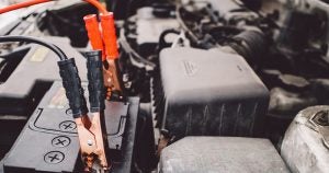 Jumper cables on car battery | Briarwood Ford in Saline, MI