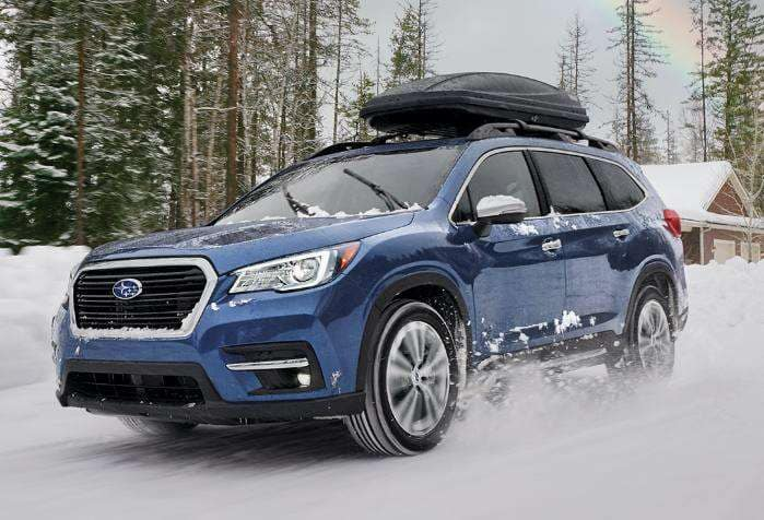 Blue Subaru in the snow