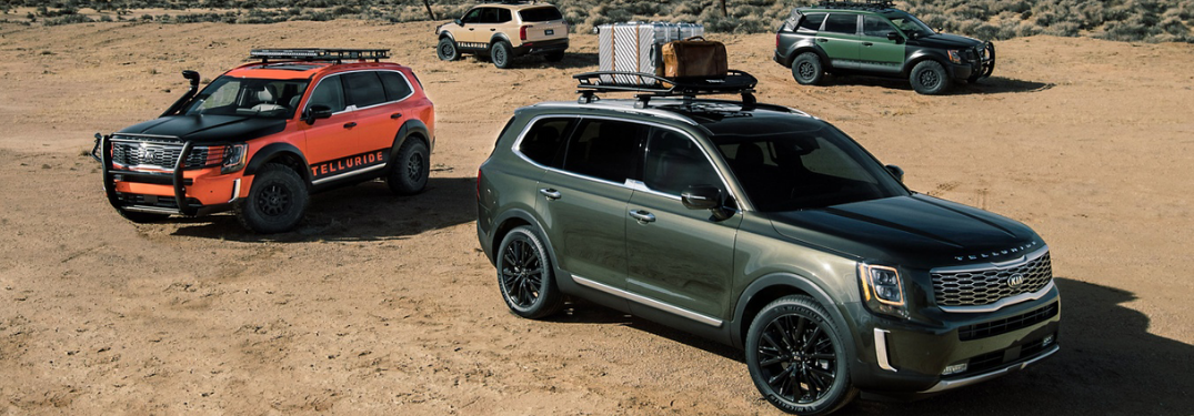 Three 2020 Kia Telluride parked outside in sand