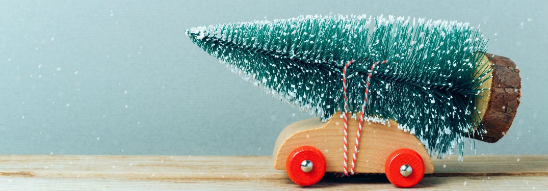 Toy car with Christmas tree on top