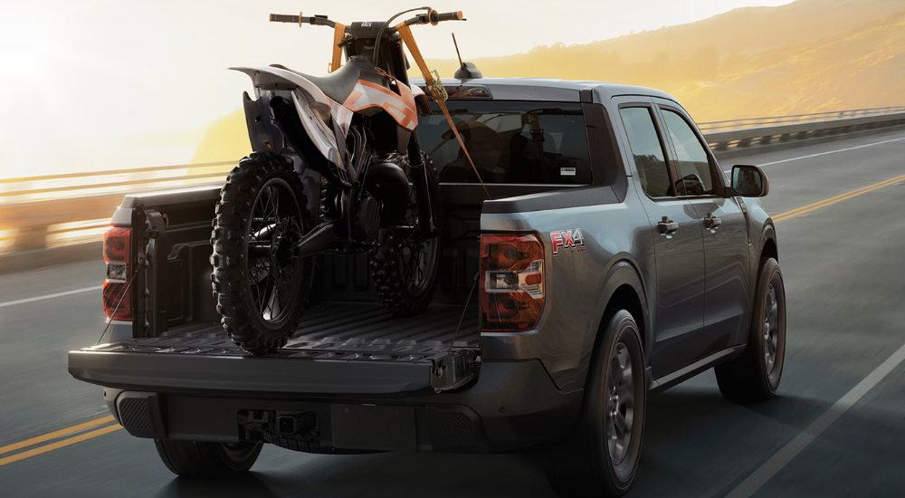 Grey 2026 Ford Maverick Fx4 hauling a dirt bike