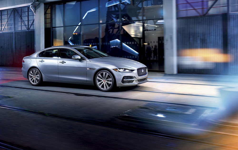 2020-Jaguar-XE-side-view-motion-silver