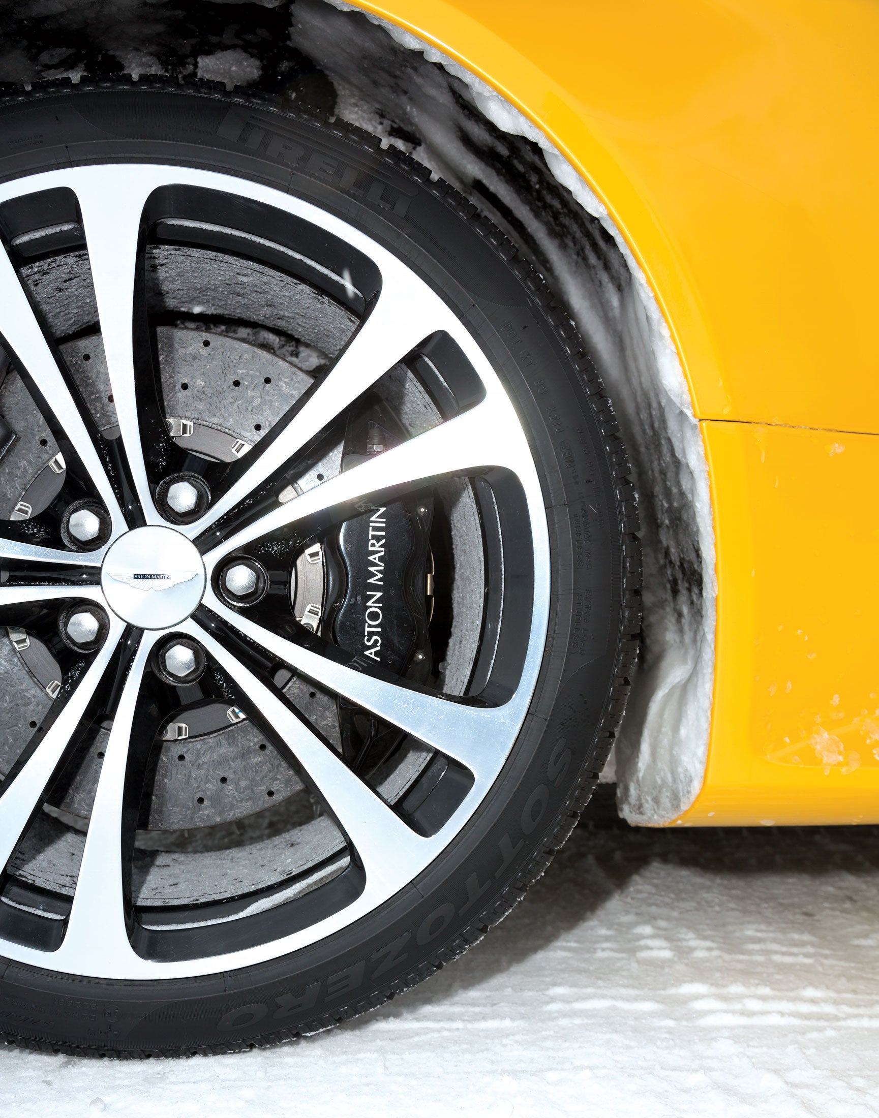 Standard snow tires on an Aston Martin