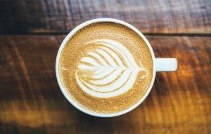 A white mug filled with a latte. | St. Louis, MO