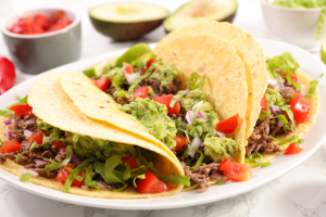 Three ground beef tacos on a white plate. | Mexican restaurants in St. Louis, MO