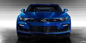 Front view of a royal blue 2021 Chevrolet Camaro parked in a garage. | Chevrolet dealer in St. Louis, MO.
