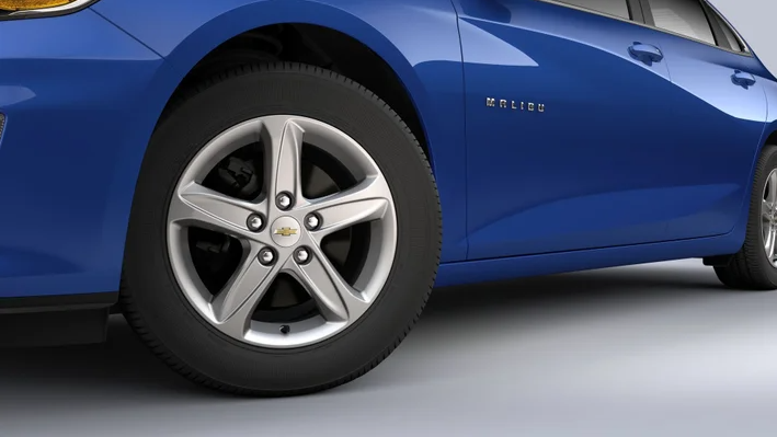 2023 Midnight Blue Chevrolet Malibu's driver side doors and tires. - Ted Britt Chevrolet Sterling, VA