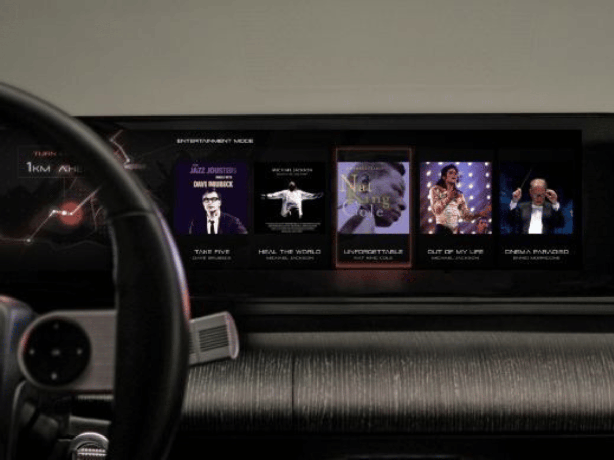 Infotainment screen displaying music options in a used Hyundai Azera, highlighting advanced technology features available at Crain Hyundai of Little Rock.