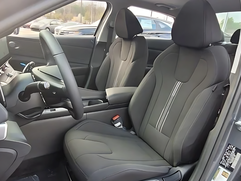 Interior front seats and cockpit of a modern Hyundai showcasing premium materials and technology