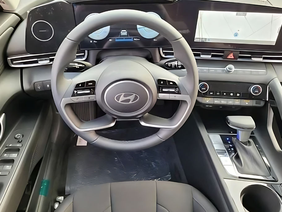 Close-up of Hyundai’s digital dashboard and steering wheel inside a modern vehicle