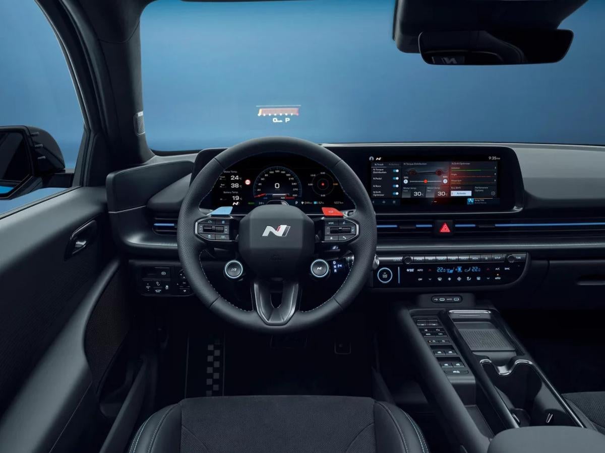 Interior view of the 2026 Hyundai IONIQ 6 N cockpit featuring an N-exclusive steering wheel, dual 12.3-inch displays, and performance-tracking software.