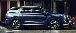Profile view of a parked navy 2022 Hyundai Palisade. | Hyundai dealer in Little Rock, AR.
