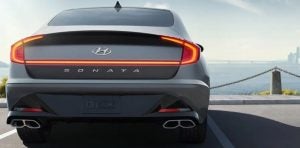 Rear view of a parked, gray 2021 Hyundai Sonata. | Hyundai dealer in Little Rock, AR.