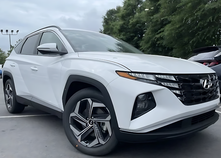 Front and side view of a white Hyundai Tucson parked outdoors, perfect for leasing options at Crain Hyundai of Little Rock