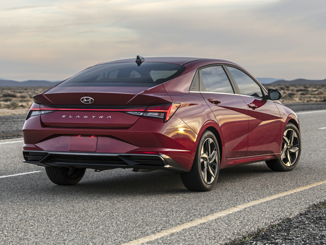 A dark red 2023 Hyundai Elantra parked on the road. | Hyundai dealer in Little Rock, AR | Crain Hyundai of Little Rock