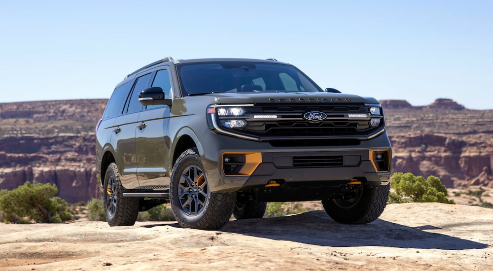 Dark green 2026 Ford Expedition parked off-road.
