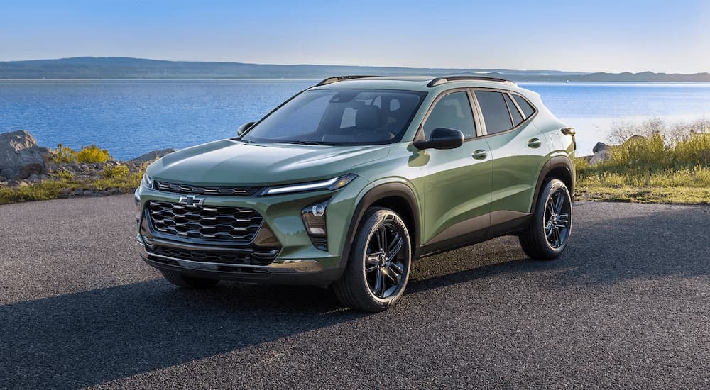 Green 2025 Chevy Trax ACTIV parked near an ocean