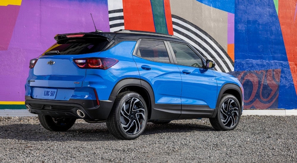 A blue 2025 Chevy Trailblazer RS from the rear at an angle.