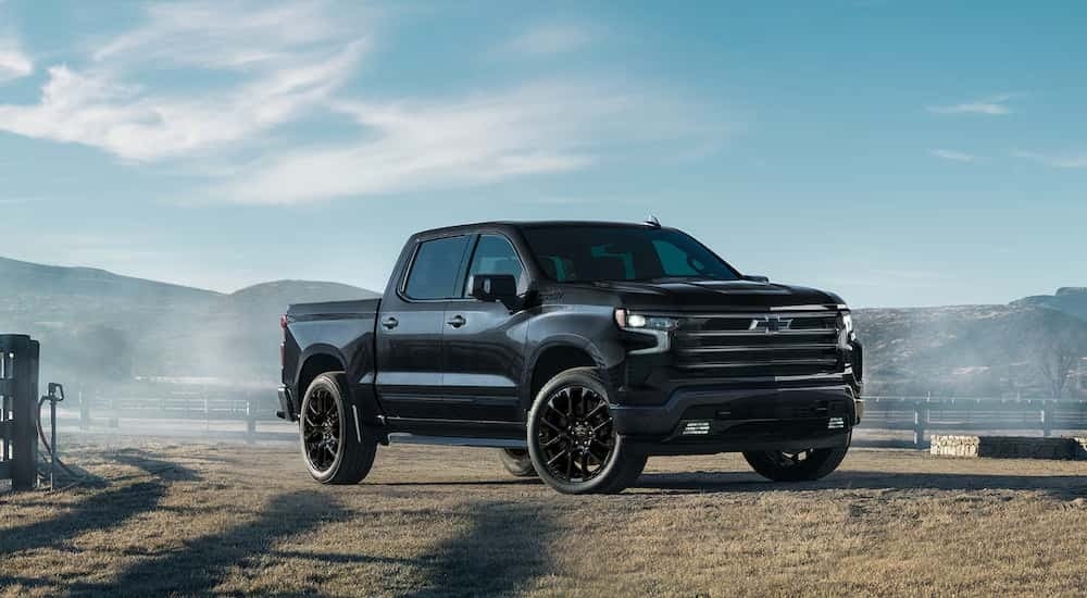 Black 2026 Chevy Silverado 1500 parked on a farm