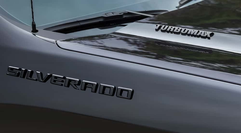 Hood and badge on a black 2026 Chevy Silverado 1500