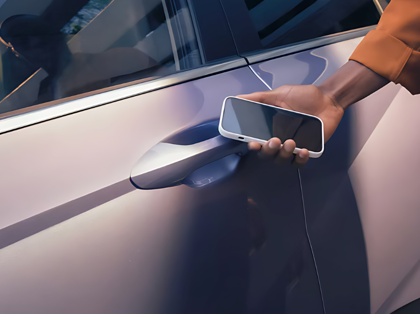 Close-up of a person using a smartphone to unlock a Hyundai vehicle with Hyundai Digital Key 2