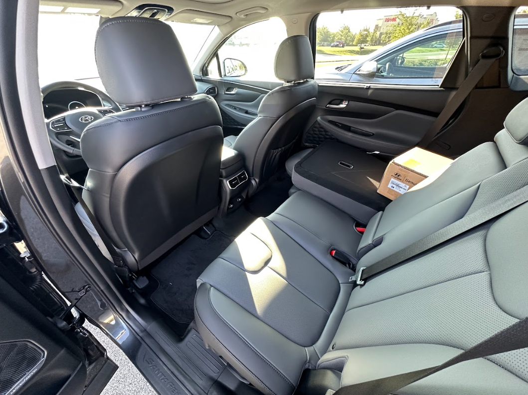 Spacious rear seating area in a Hyundai SUV with folded seat and family-ready features