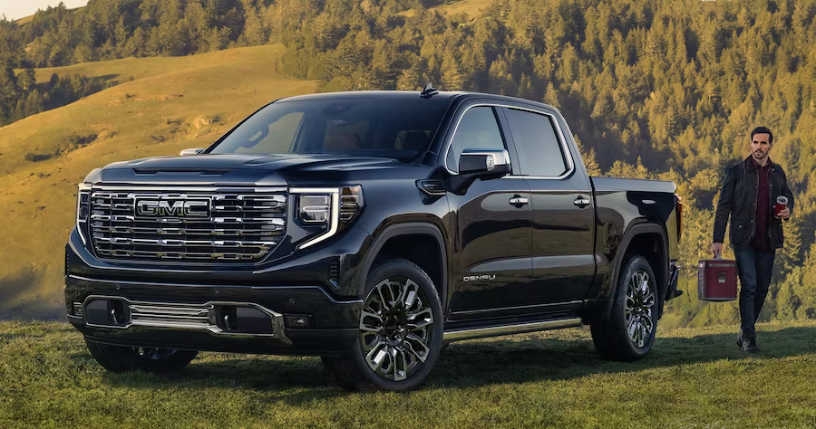 2023 GMC Sierra SUV with a man