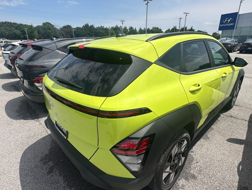 Bright green Hyundai Kona parked at Crain Hyundai of Fayetteville showcasing its modern design