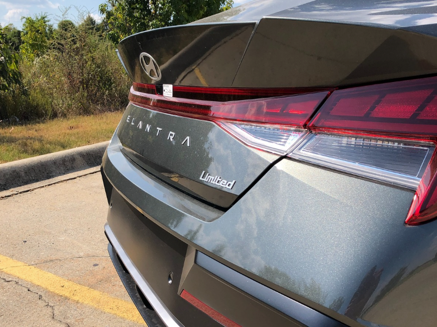 Close-up of the rear badge and taillight of a Hyundai Elantra Limited trim parked at Crain Hyundai of Fayetteville.