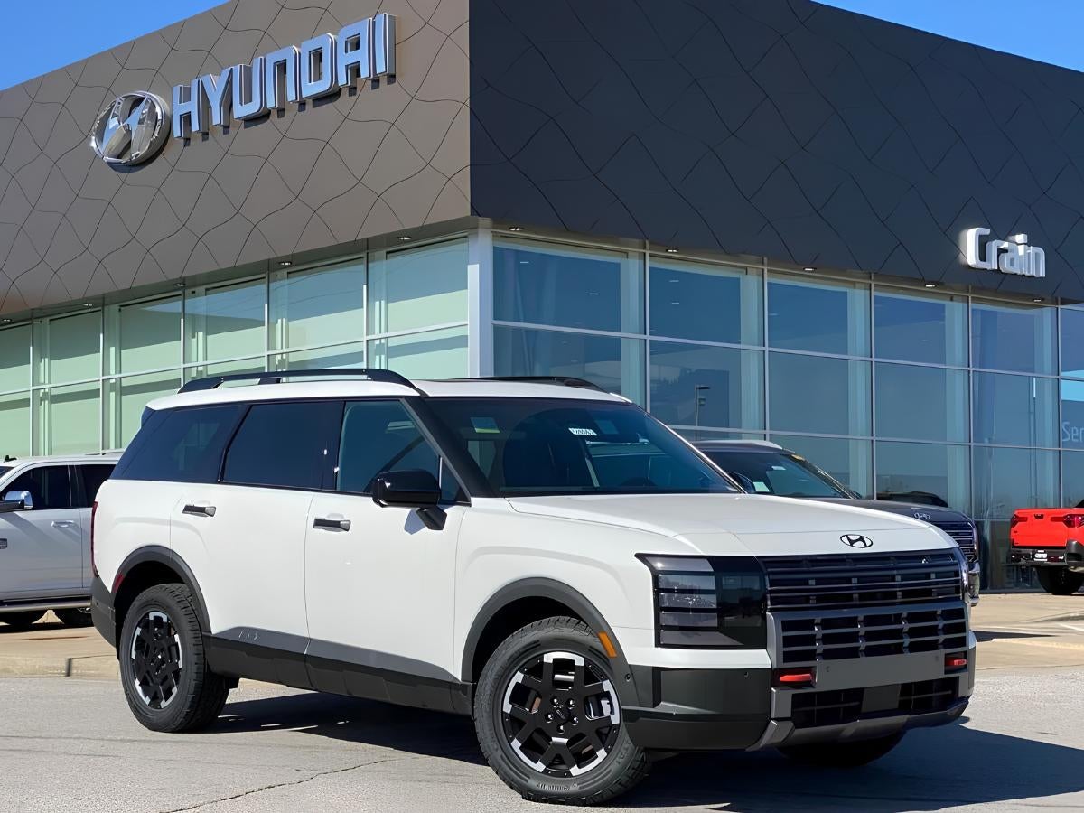 White 2026 Hyundai Palisade parked outside Crain Hyundai of Fayetteville dealership