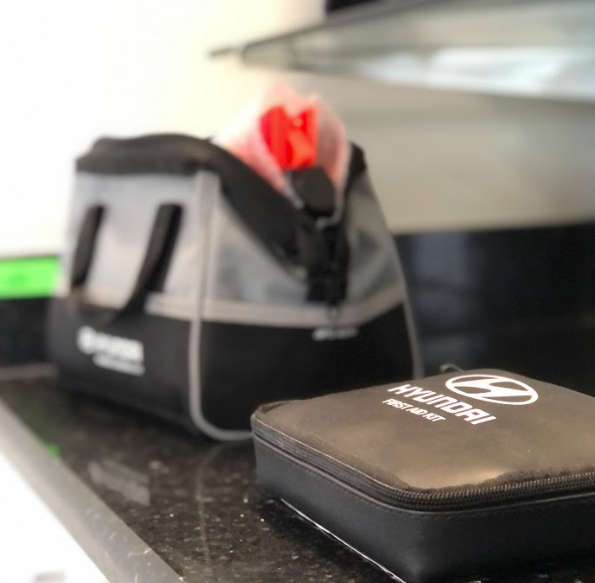 Hyundai-branded accessory and first aid kits on display