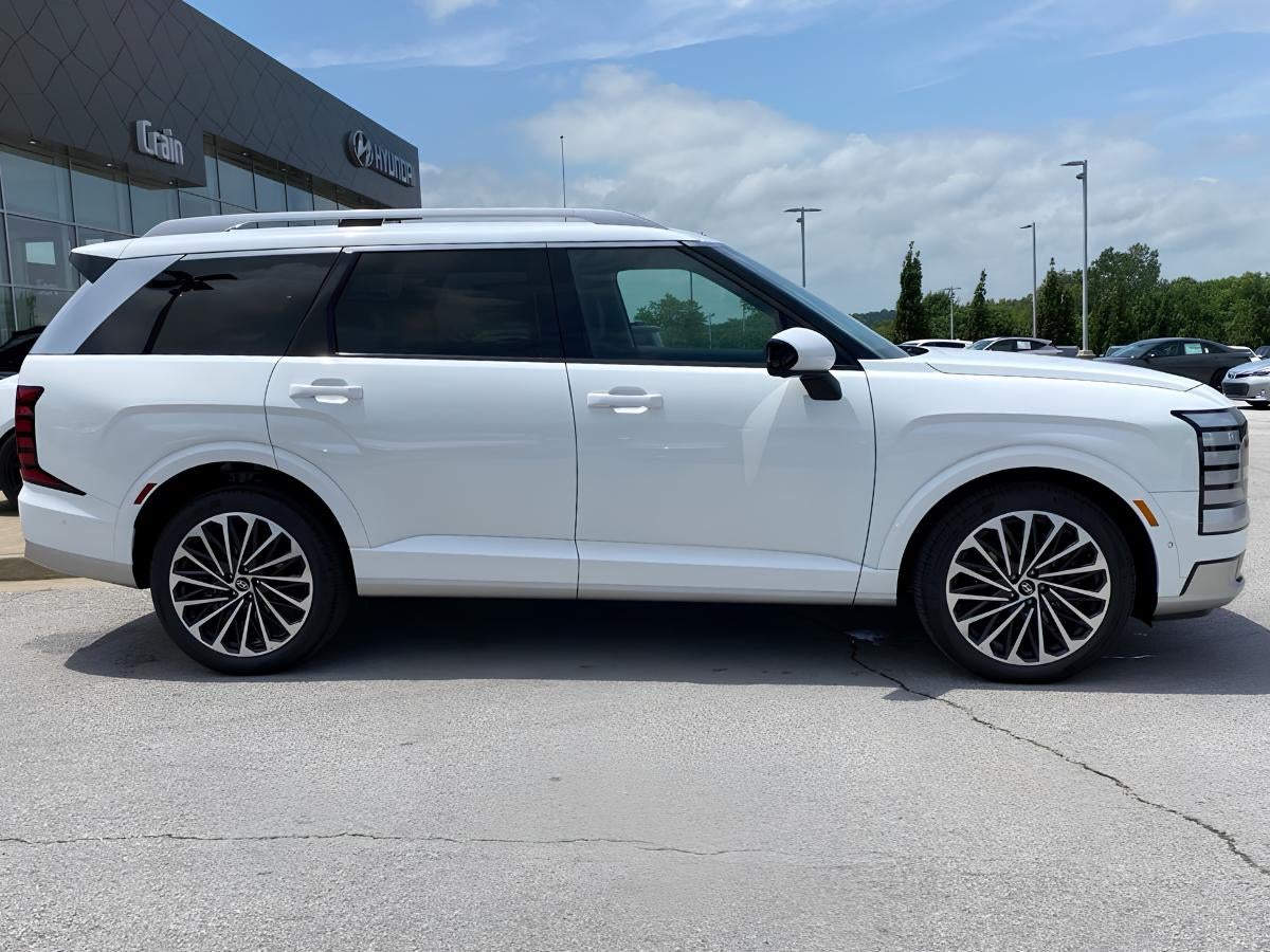 White Hyundai Palisade parked outside Crain Hyundai of Fayetteville dealership