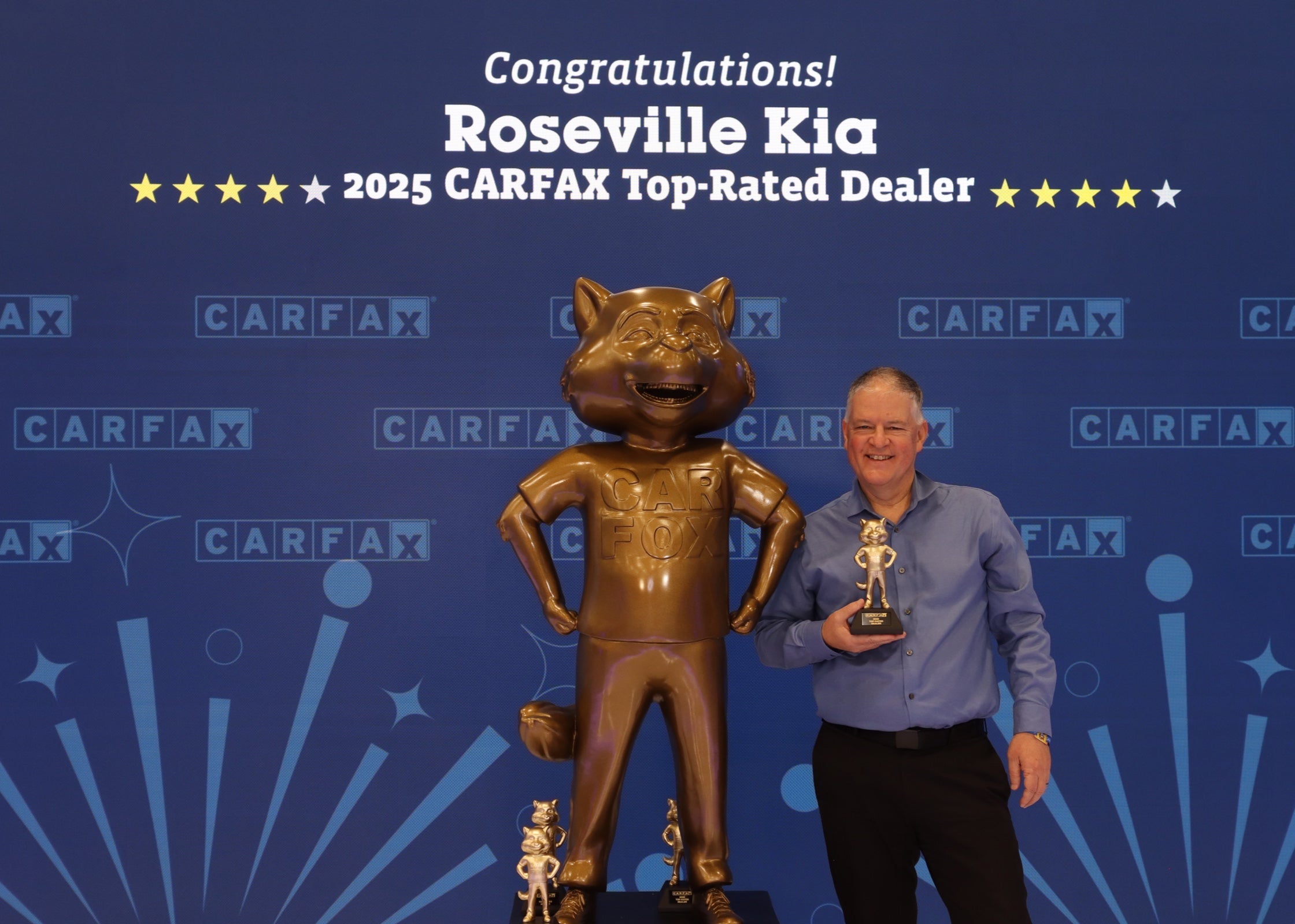 Scott Skougard accepts CarFax Top-Rated Dealer Award on behalf of Roseville Kia