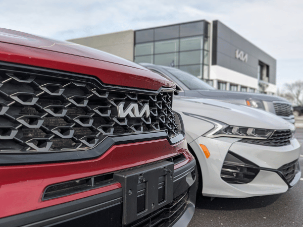 Kia sedan and SUV parked outside Crain Kia of Fayetteville