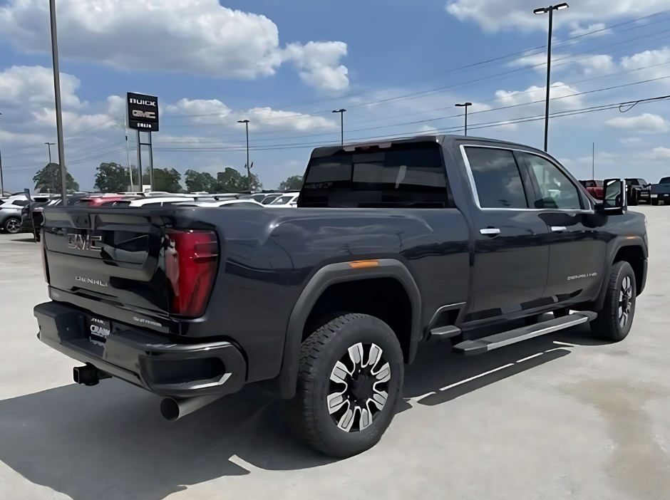 GMC Sierra Denali HD with MultiPro Tailgate parked at Crain Buick GMC in Springdale, Arkansas