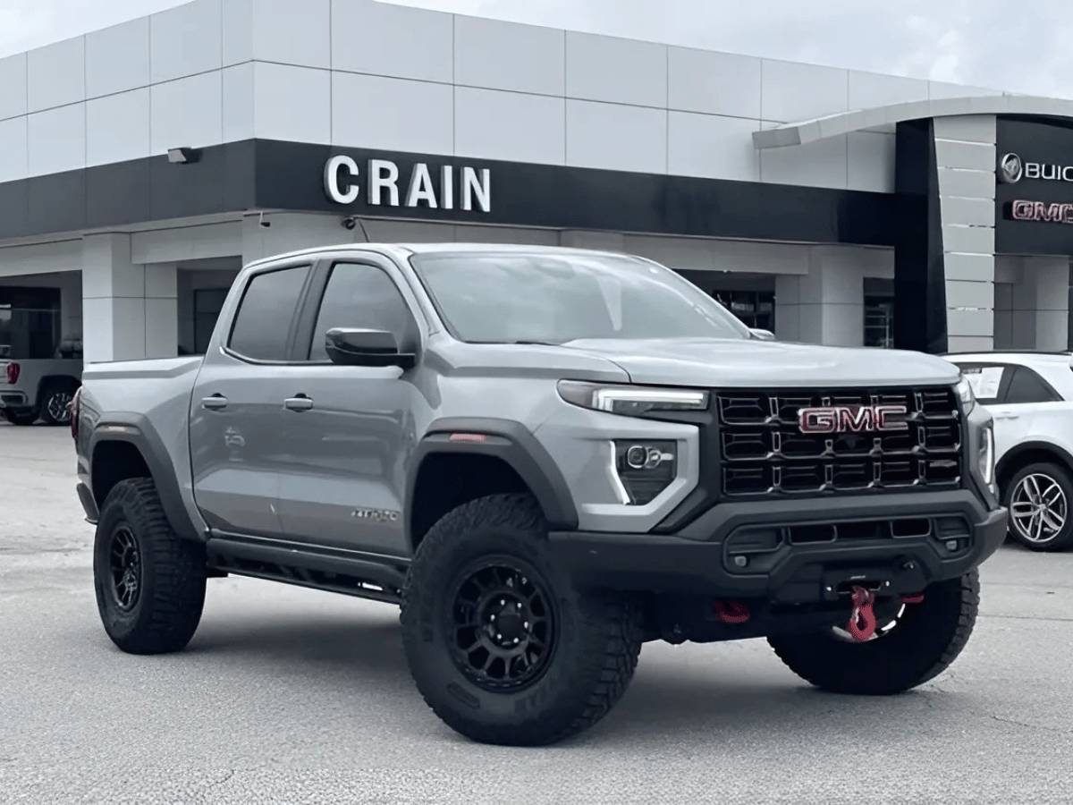 Gray used GMC Canyon truck parked outside Crain Buick GMC in Springdale, AR