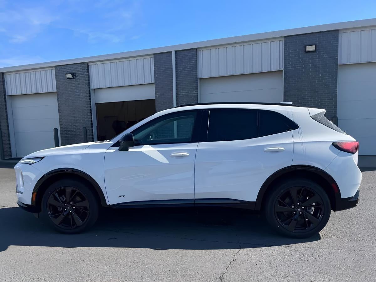 2026 Buick Envision parked at Crain Buick GMC in Springdale AR showing side profile design