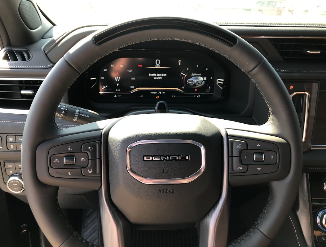 Close-up of the Denali steering wheel and Super Cruise driver display in a GMC vehicle at Crain Buick GMC in Springdale