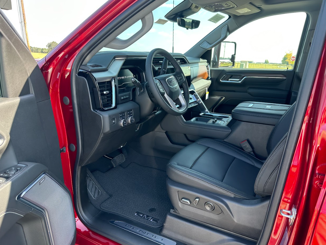 Interior view of a red GMC Denali truck at Crain Buick GMC in Springdale