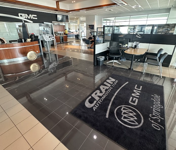 Interior of Crain Buick GMC in Springdale, showing customer seating and finance desks