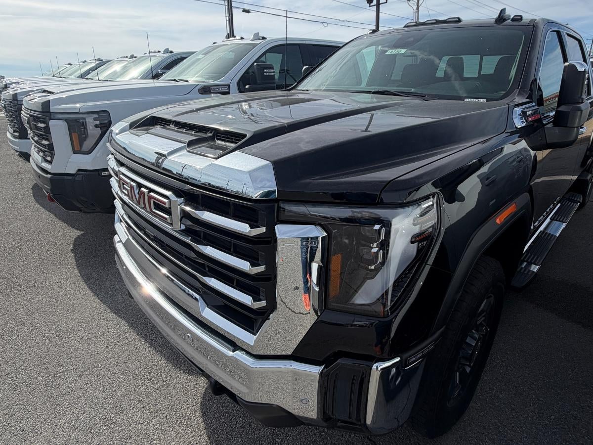 GMC trucks at Crain Buick GMC in Springdale, AR dealership lot