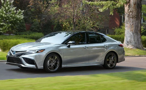 2022 Toyota Camry Hybrid driving in Frederick, MD