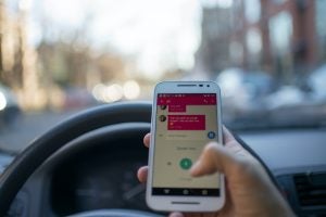 Man driving while texting | Lanham, MD