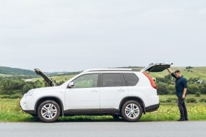 Man with car on side of the road | Lanham, MD